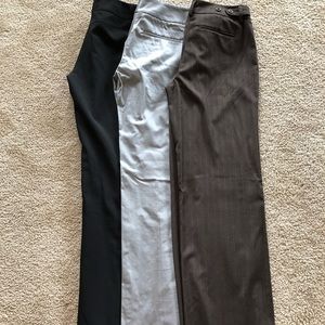 Three pair of New York & Company dress pants.